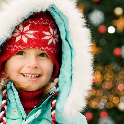 Little girl looking at Christmas lights