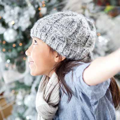 Native American girl playing in the snow