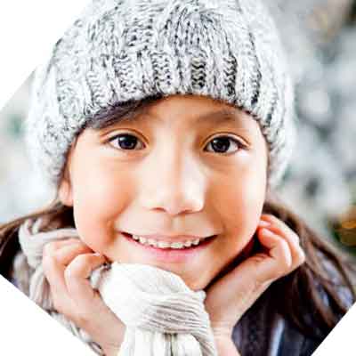 Young Native American girl smiling in the snow