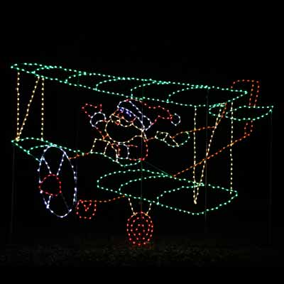 Light display of Santa flying an airplane