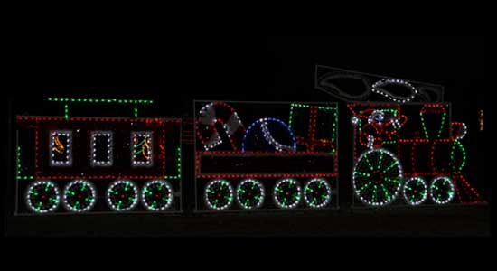 Christmas lights display of Santa driving a train